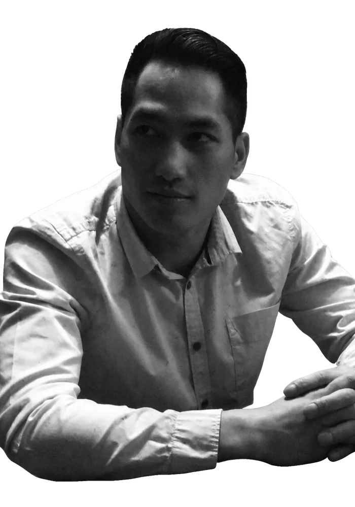 Black-and-white portrait of Lovisse seated at a table